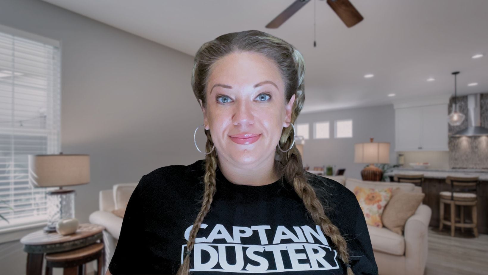 Captain Duster team member smiling in a freshly cleaned living room