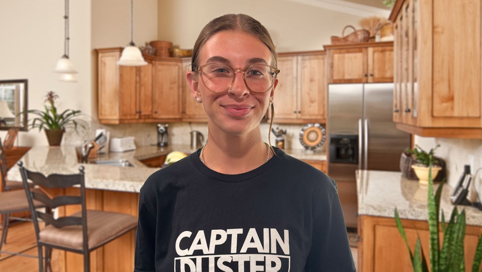 House cleaner from Captain Duster organizing a bright kitchen with shiny countertops
